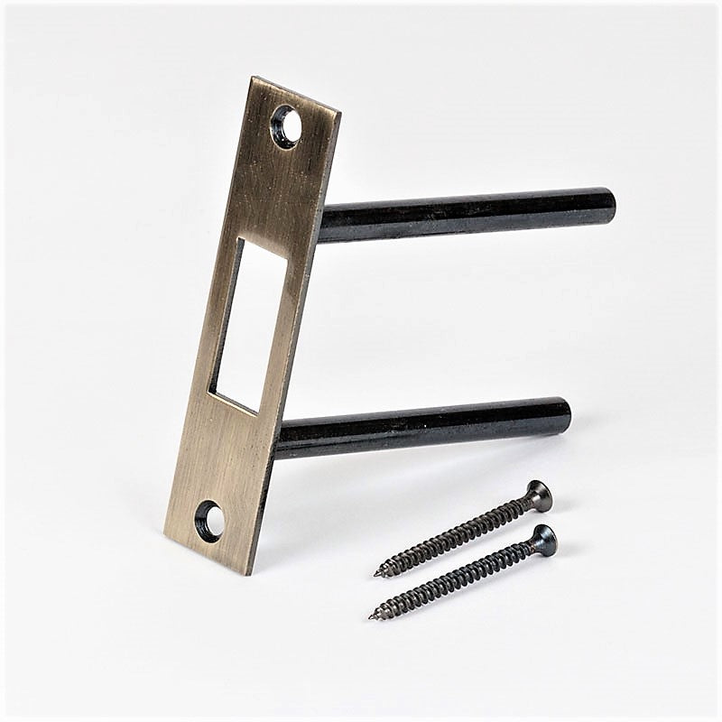 Two-post strike plate by Tuff Strike in antique brass finish, side view on a white background.